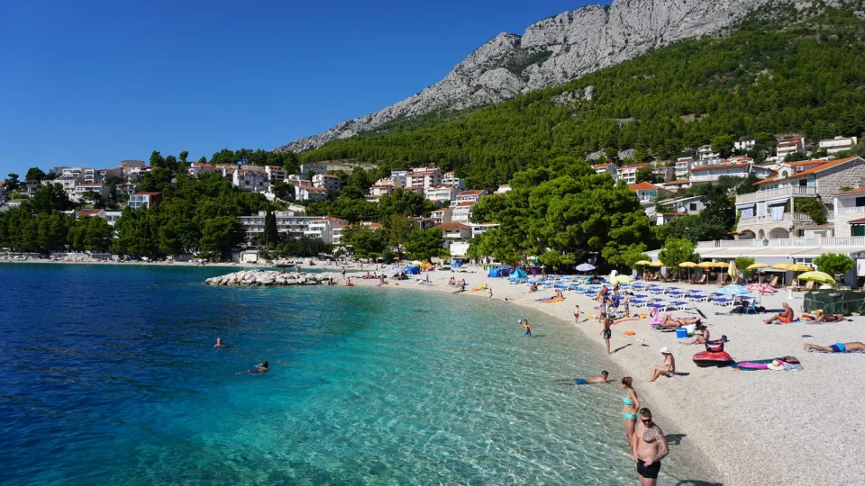 The coast at Baška Voda beside clear Adriatic water.