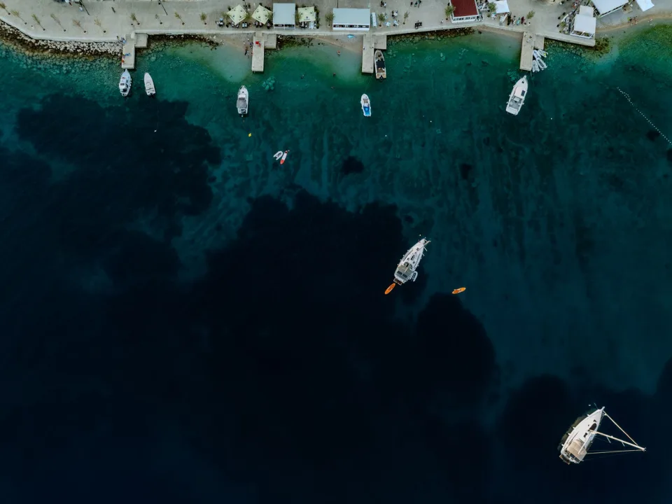 Boats off the Primošten coastline seen from above.