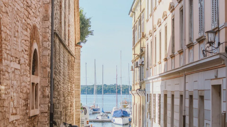 A view toward Pula marina from a narrow street.