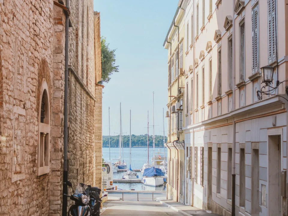 A view toward Pula marina from a narrow street.