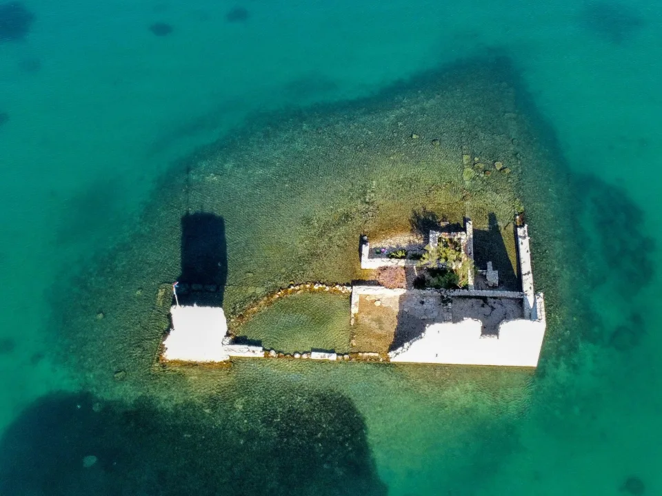 A small coastal islet with ruins off Sukošan.