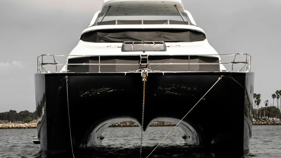 Front view of a power catamaran with twin hulls.