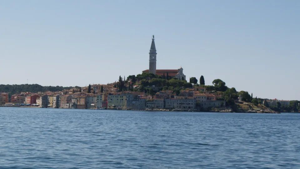 Rovinj old town and church tower seen across the sea