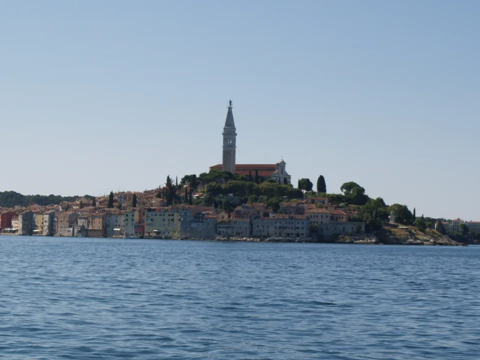 Rovinj old town and church tower seen across the sea