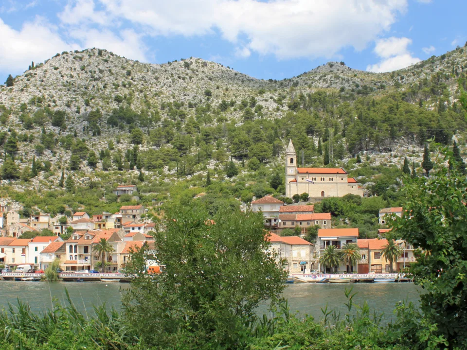 Regional view of Komin village across the Neretva River