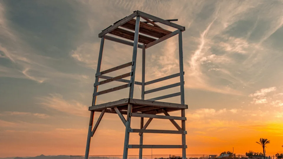 Wooden tower at sunset on Agios Kosmas Beach in Elliniko
