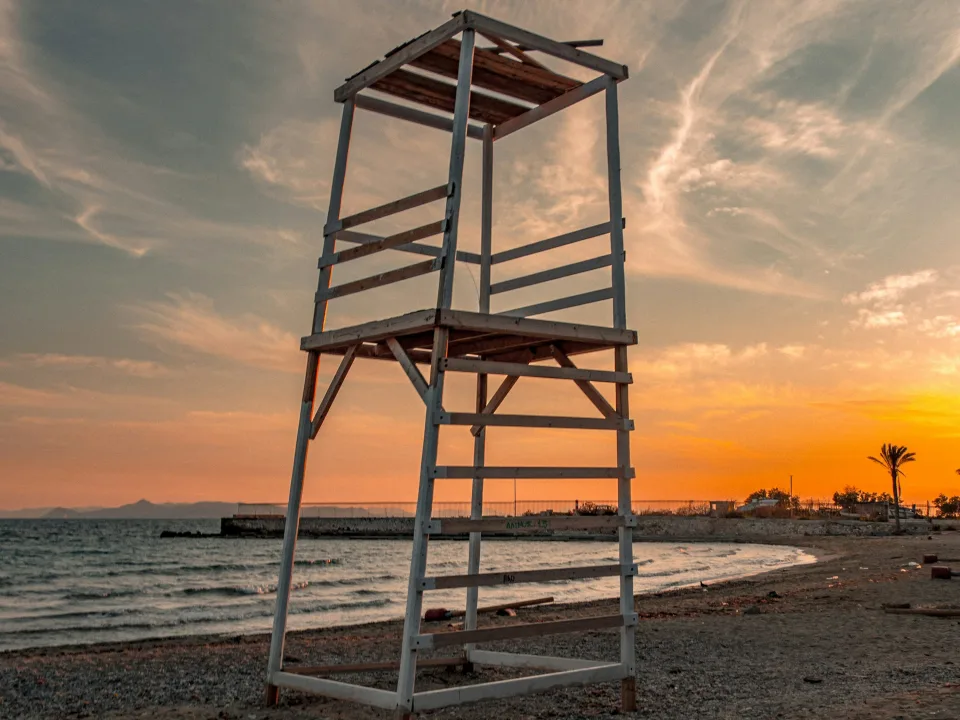 Wooden tower at sunset on Agios Kosmas Beach in Elliniko