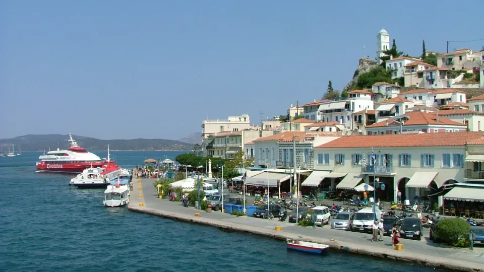 Poros town waterfront and clock tower beside the sea