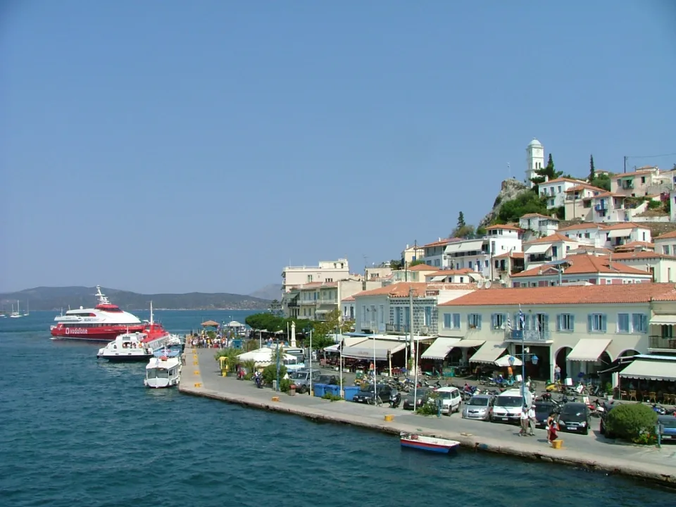 Poros town waterfront and clock tower beside the sea