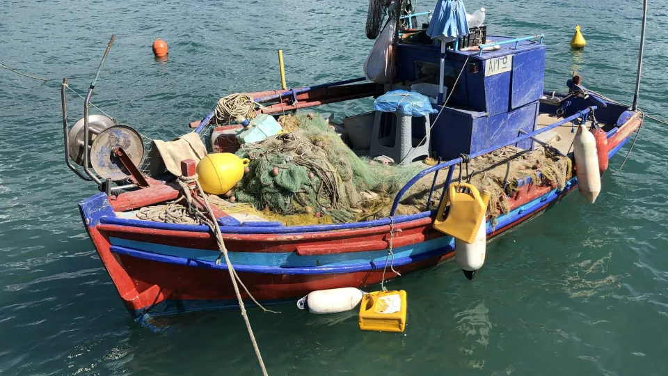 Colourful fishing boat with nets at Lygia on Lefkada