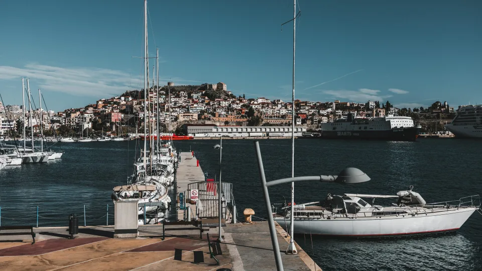 Boats in Kavala harbour below the hillside old town
