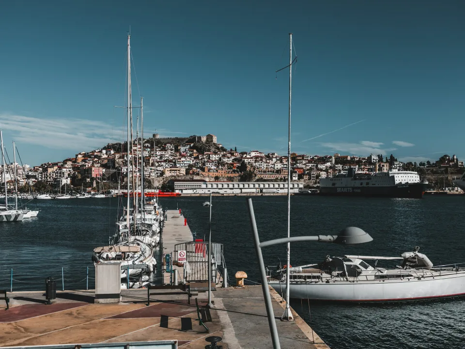 Boats in Kavala harbour below the hillside old town