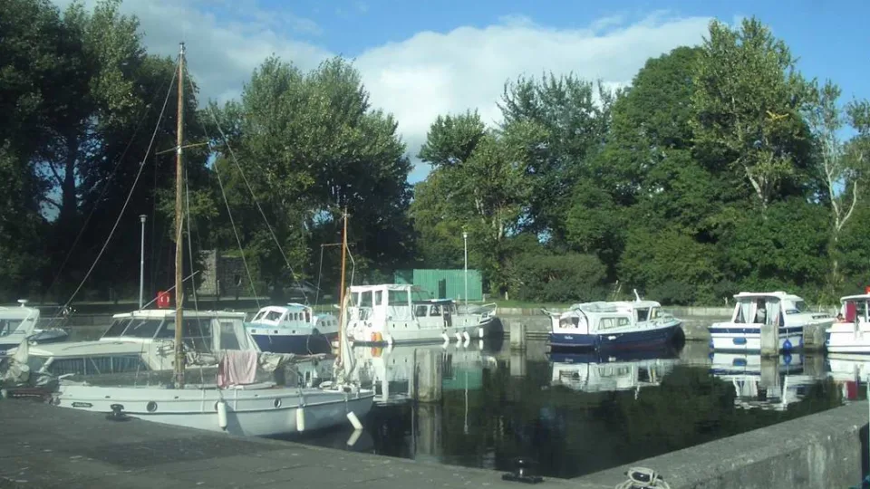 Regional harbour context: a historical view of New Harbour in Portumna, with small boats and trees