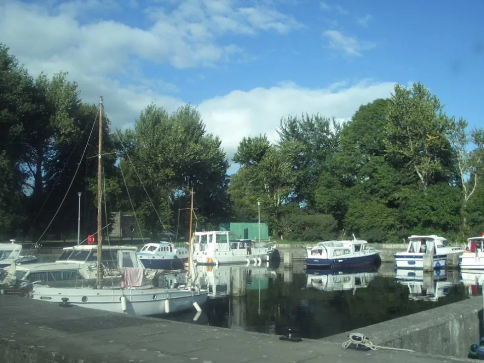 Regional harbour context: a historical view of New Harbour in Portumna, with small boats and trees