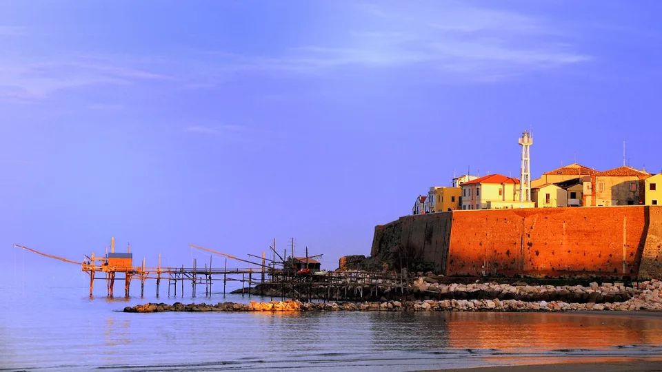 Termoli old town walls and a fishing platform beside the sea