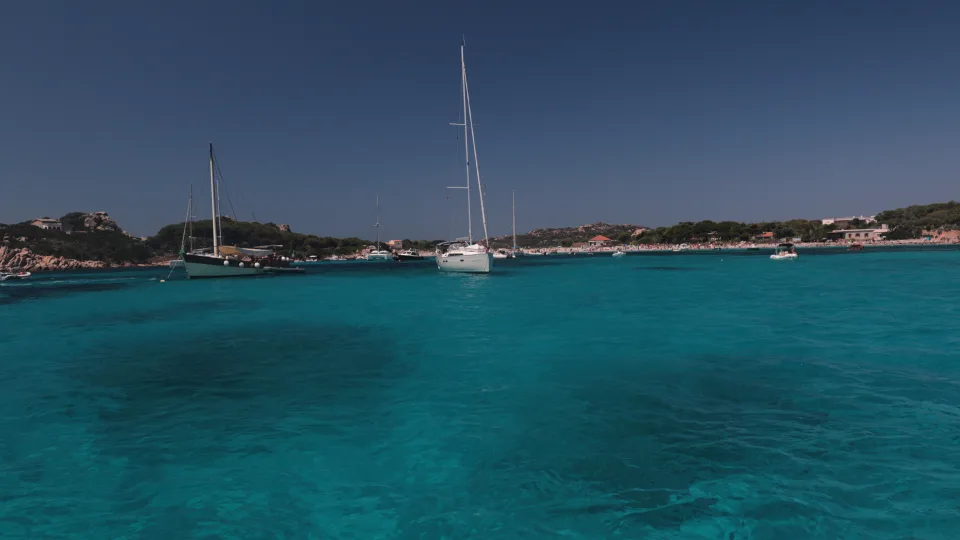 Regional island context: sailing yachts in a bay of the La Maddalena archipelago, northern Sardinia