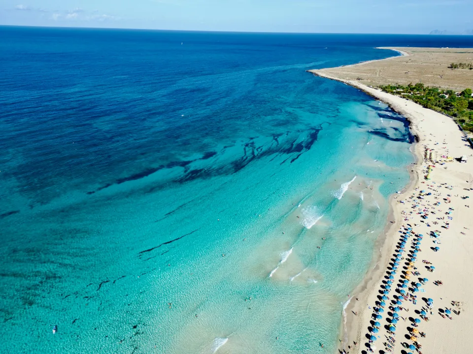 Beach and turquoise water at San Vito Lo Capo