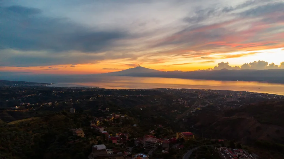 Sunset coastal panorama at Reggio Calabria across the Strait of Messina