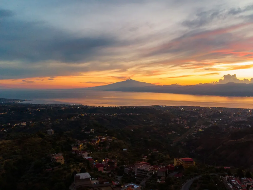 Sunset coastal panorama at Reggio Calabria across the Strait of Messina