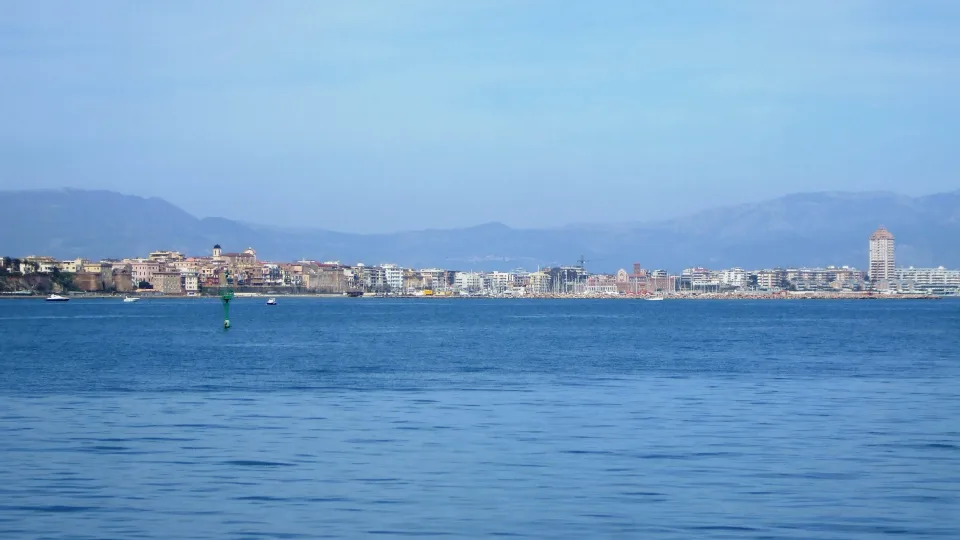 Regional departure context: Nettuno waterfront and marina viewed from the sea