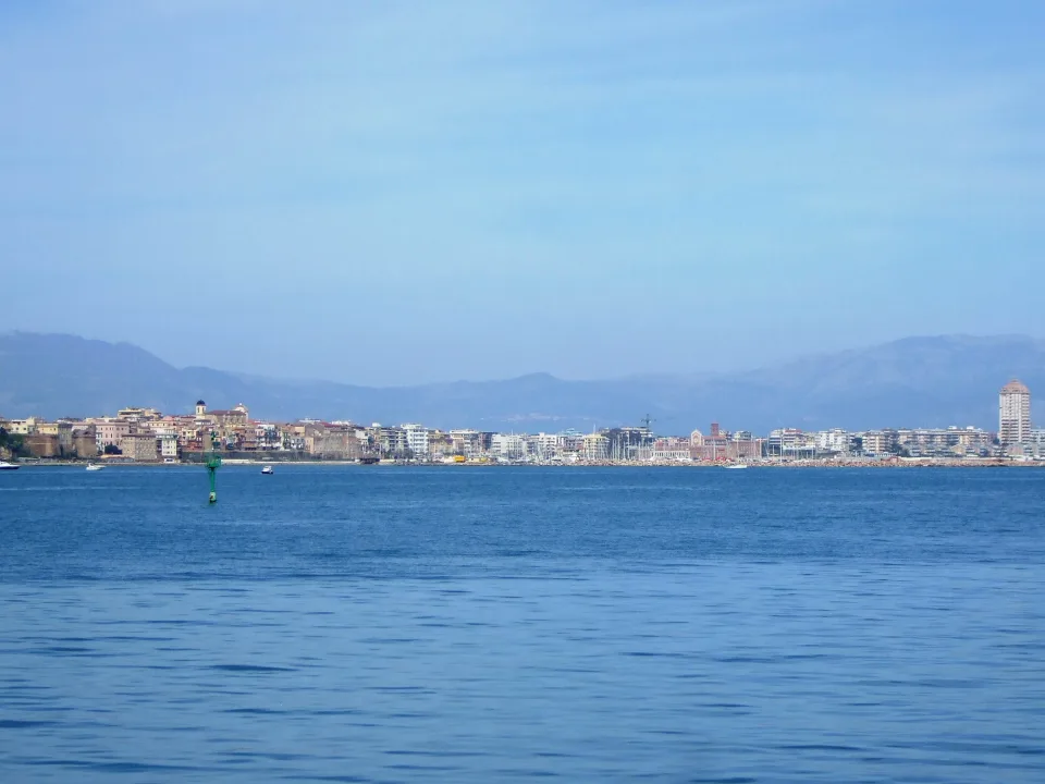 Regional departure context: Nettuno waterfront and marina viewed from the sea