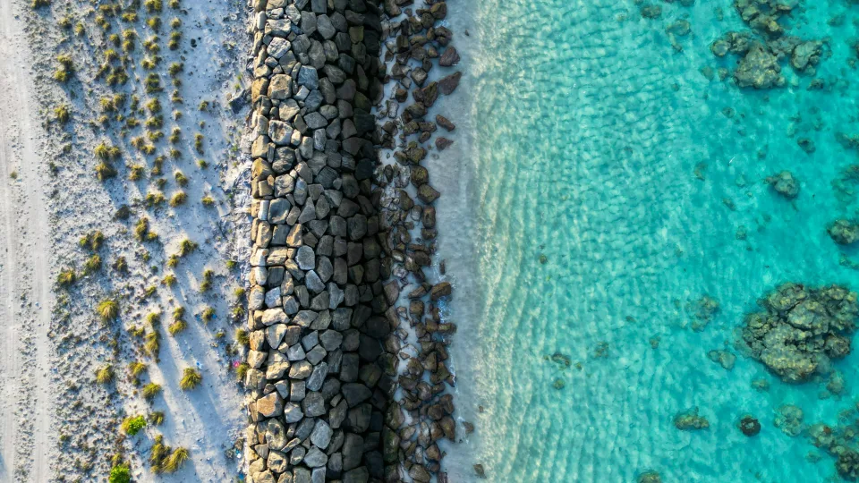 Rock-lined shoreline and water in Hulhumalé