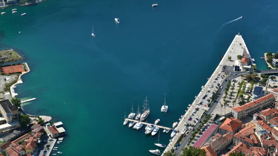Kotor bay with moored boats and waterfront buildings