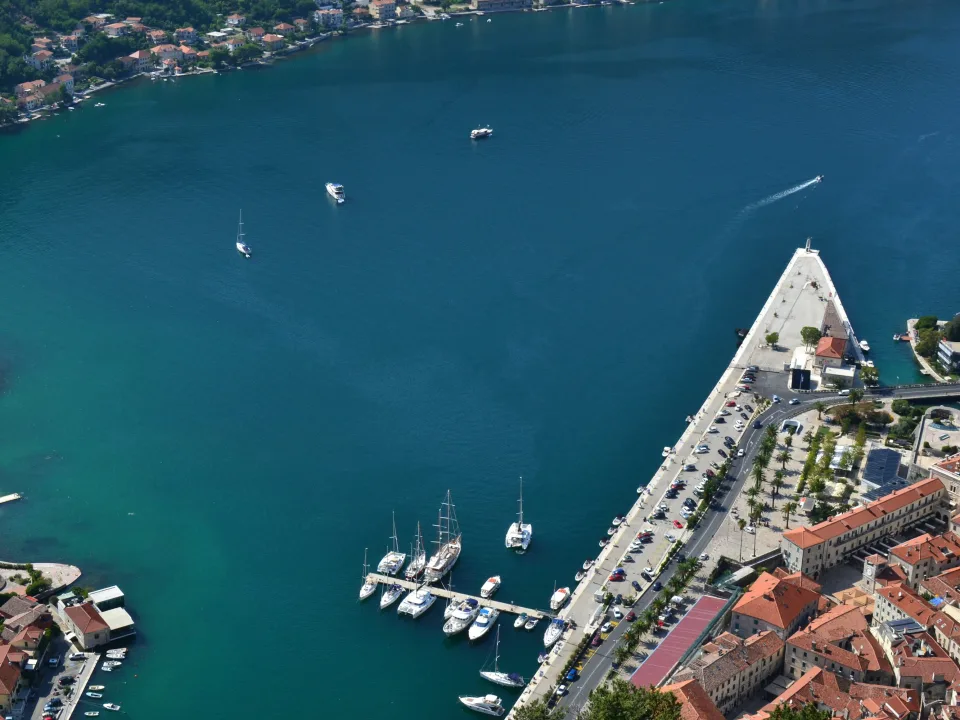 Kotor bay with moored boats and waterfront buildings