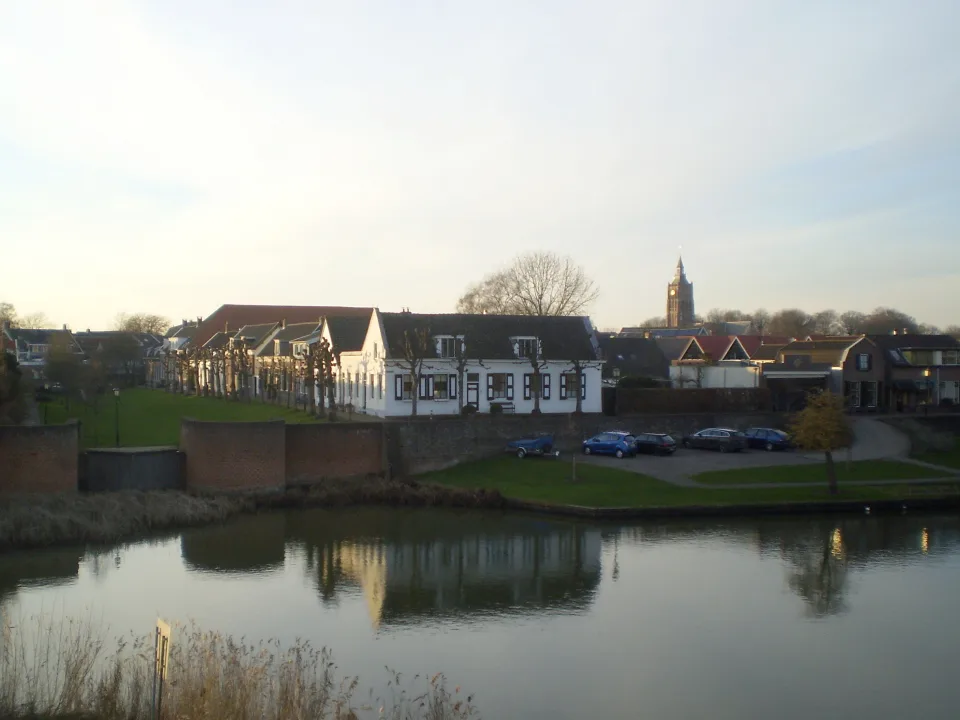 Regional waterway context: river Linge beside historic waterfront buildings at nearby Asperen