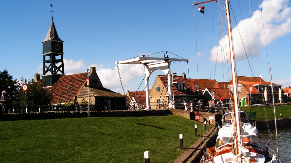 Harbour lock, bridge and sailboat at Hindeloopen