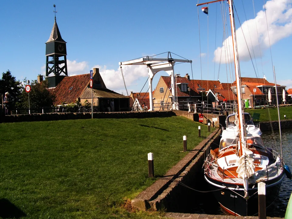 Harbour lock, bridge and sailboat at Hindeloopen