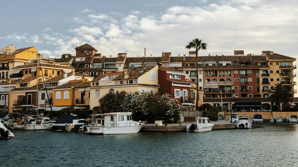Boats and colourful waterfront houses in Port Saplaya, Alboraya, Spain
