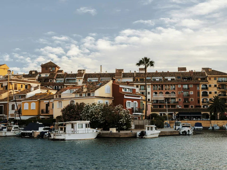 Boats and colourful waterfront houses in Port Saplaya, Alboraya, Spain
