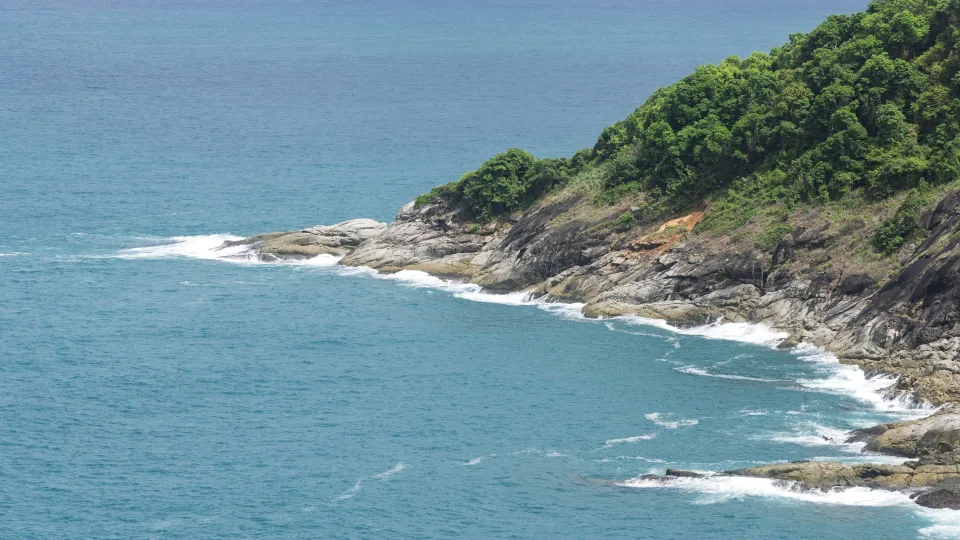 Forested rocky coastline and sea in Phuket, Thailand