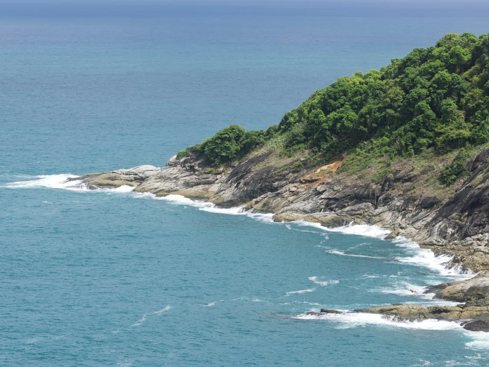 Forested rocky coastline and sea in Phuket, Thailand