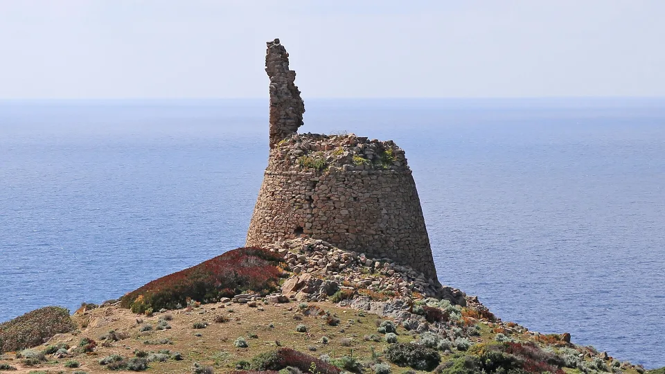 The ruined Capo di Feno tower above the sea in the commune of Ajaccio.