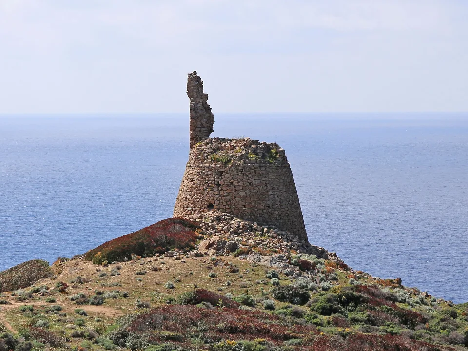 The ruined Capo di Feno tower above the sea in the commune of Ajaccio.