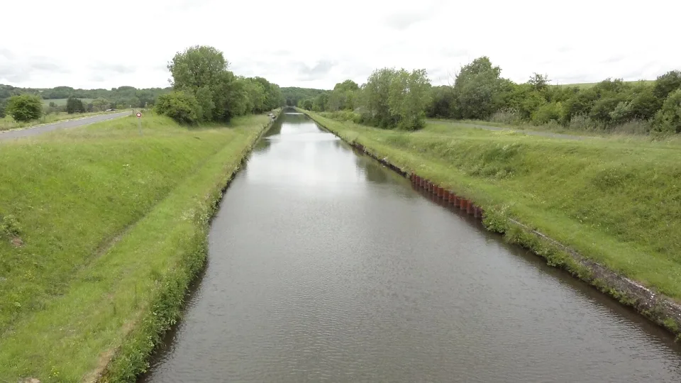 The Canal de la Marne au Rhin with grassy towpaths at Hesse, Moselle.