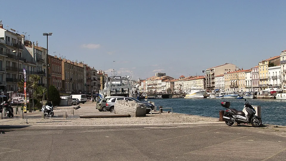 Waterside buildings and boats along a canal in Sète.