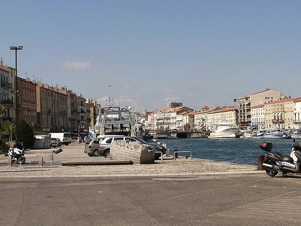 Waterside buildings and boats along a canal in Sète.