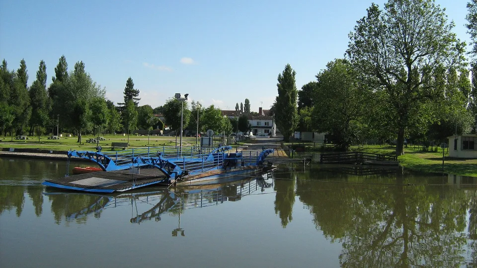 The ferry and tree-lined River Charente at La Baine, near Chaniers.