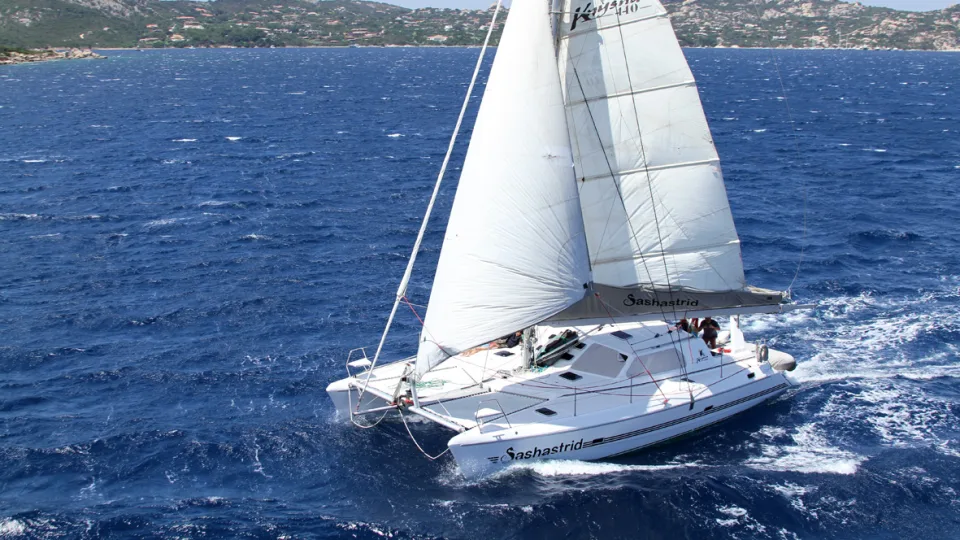 Sailing catamaran in the Strait of Maddalena, Sardinia