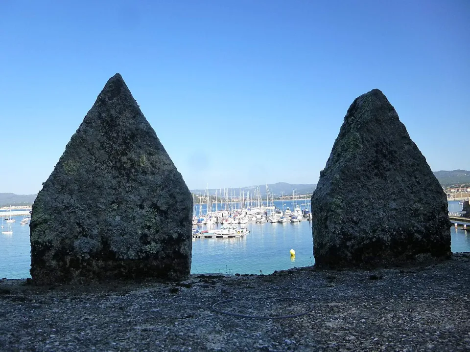 Baiona harbour seen through the walls of the waterfront fortress.