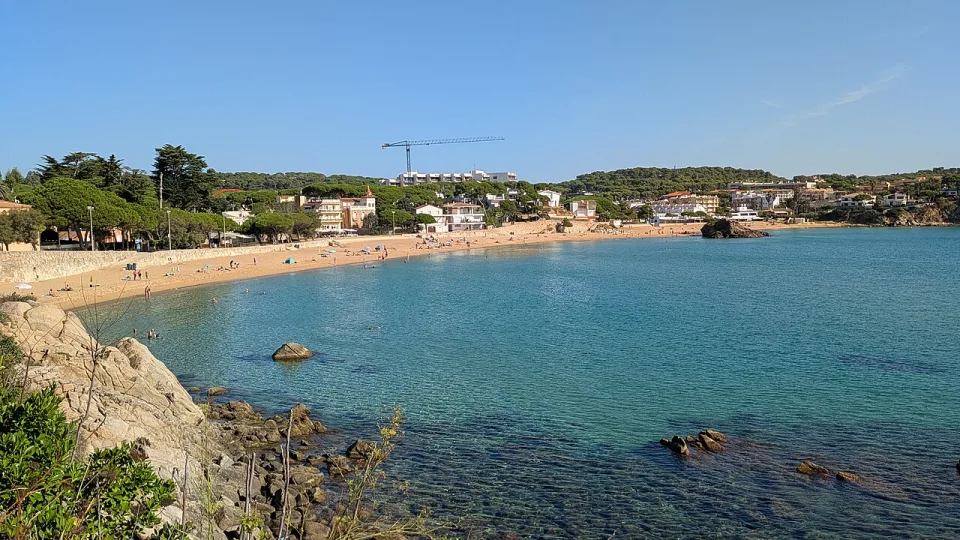The sandy bay and rocky shore at La Fosca in Palamós.