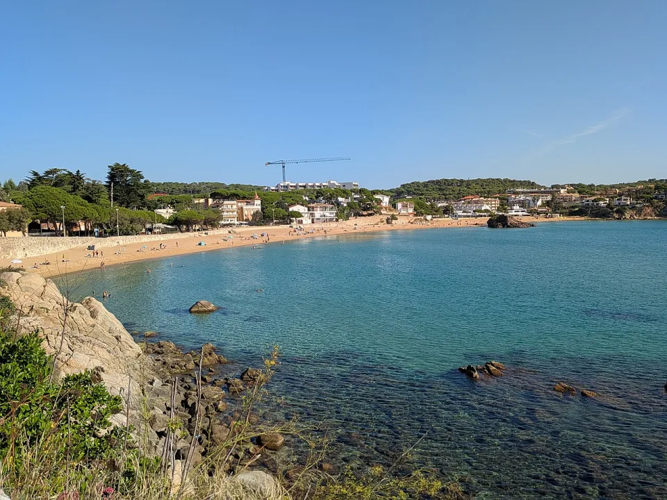 The sandy bay and rocky shore at La Fosca in Palamós.