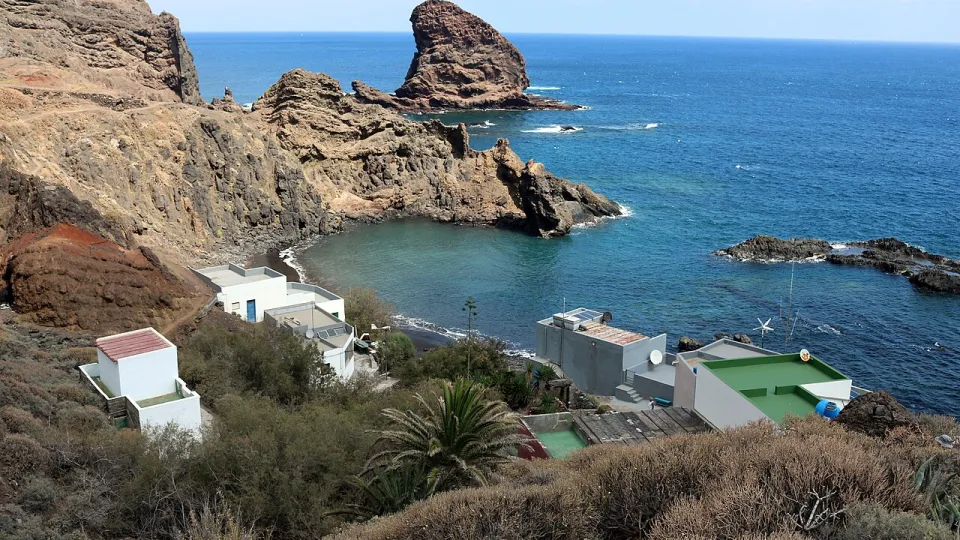 Regional Tenerife context: volcanic rocks and the bay at Roque Bermejo.