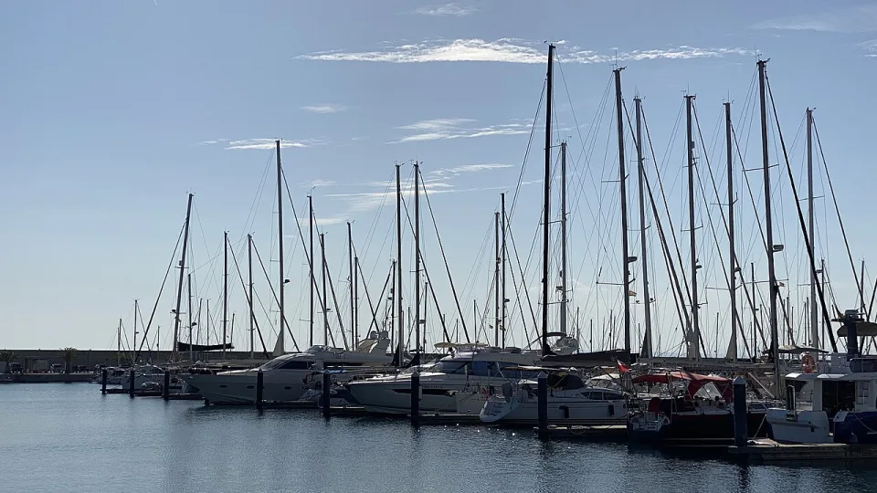 Sailing yachts moored along the pontoons at Valencia Mar.