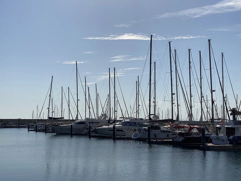 Sailing yachts moored along the pontoons at Valencia Mar.