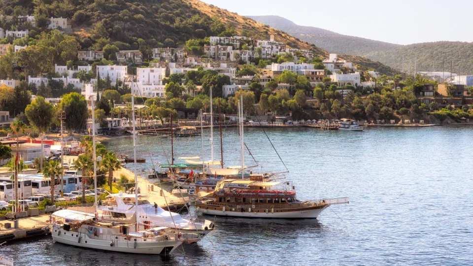 Wooden sailing vessels moored along the Bodrum waterfront.