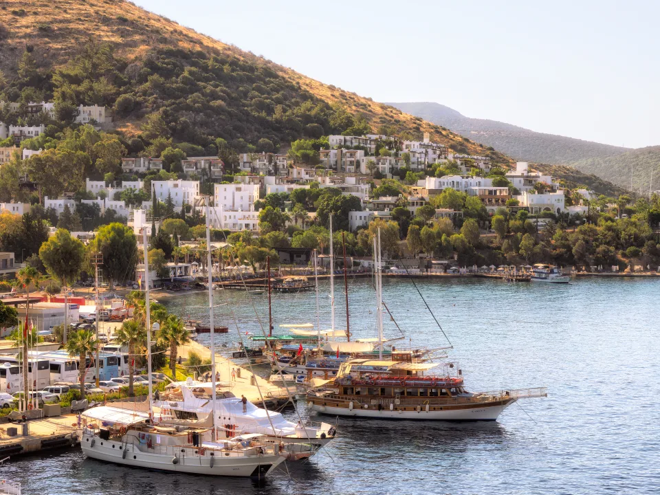 Wooden sailing vessels moored along the Bodrum waterfront.